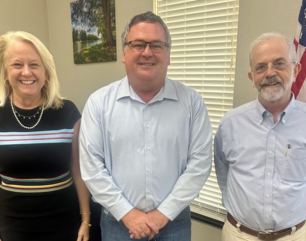 L to R: Rachel Johnston (left) and Mayor Joe Herring (right) are appointed as members to KPUB’s Board of Trustees at its May 15 board meeting. Pictured with KPUB’s General Manager & CEO, Mike Wittler (center).